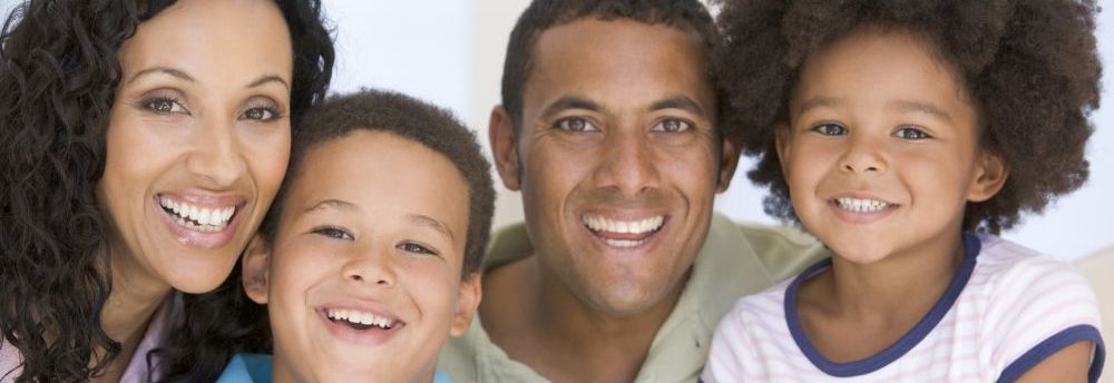 picture of happy parents and two students who use Spelling Power.