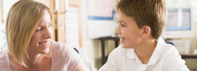 picture of parent and son happy about Spelling Power's Activity Task Sards.